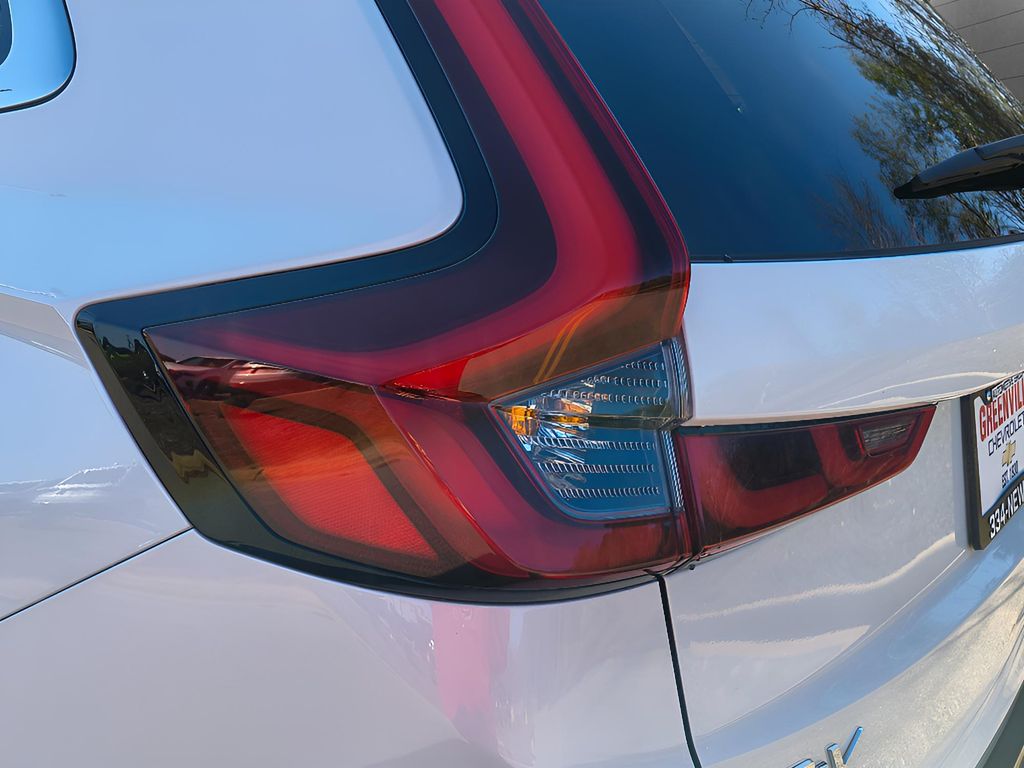 2025 Honda CR-V Hybrid Sport Touring - White exterior view 4