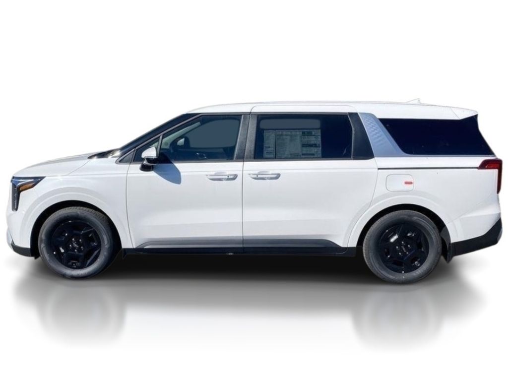 2026 Kia Carnival LXS - Snow White Pearl exterior view 4