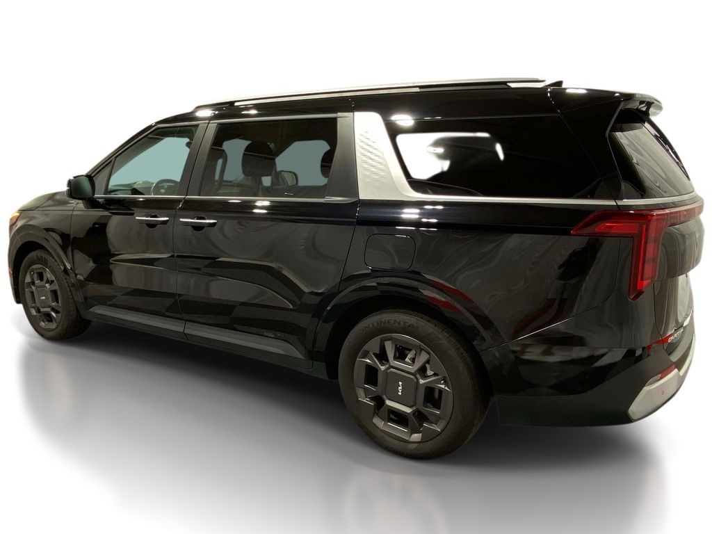 2025 Kia Carnival Hybrid EX - Aurora Black Pearl exterior view 2